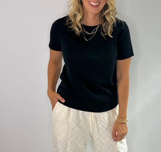 Soft crewneck color block tee in black, taupe, and cream with relaxed fit and short sleeves.