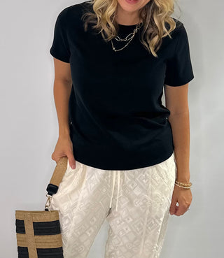 Soft crewneck color block tee in black, taupe, and cream with relaxed fit and short sleeves.