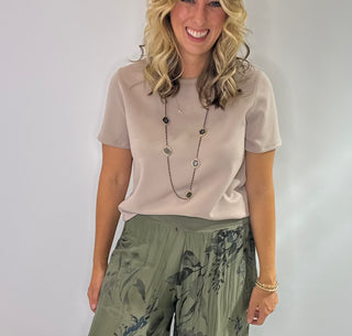 Soft crewneck color block tee in black, taupe, and cream with relaxed fit and short sleeves.