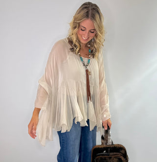 Cream Sheer silk blouse with ruffle details and lightweight fabric