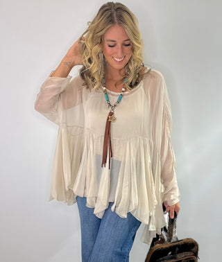 Cream Sheer silk blouse with ruffle details and lightweight fabric