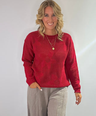 Open weave crew neck sweater with daisy pattern in rust red and taupe colors