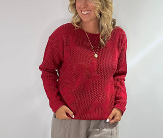 Open weave crew neck sweater with daisy pattern in rust red and taupe colors