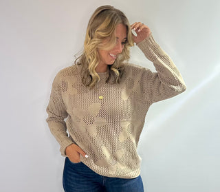 Open weave crew neck sweater with daisy pattern in rust red and taupe colors