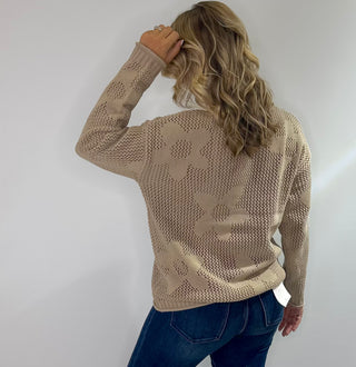 Open weave crew neck sweater with daisy pattern in rust red and taupe colors