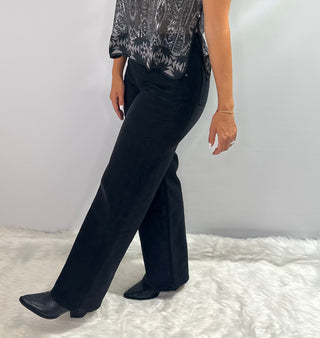 Black stretch denim jeans with waist stitching detail, straight leg, full length, and relaxed fit. 