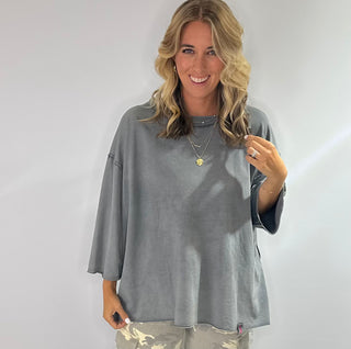 Oversized slate gray cotton top with exposed stitching and 3/4 length sleeve tee