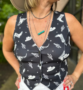 Black button front vest with Western pattern boots, hat and cactus in white