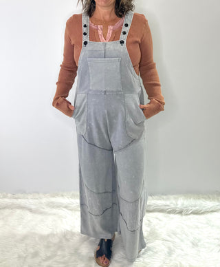 Grey French terry waffle knit patchwork jumpsuit with relaxed overall silhouette and adjustable straps 