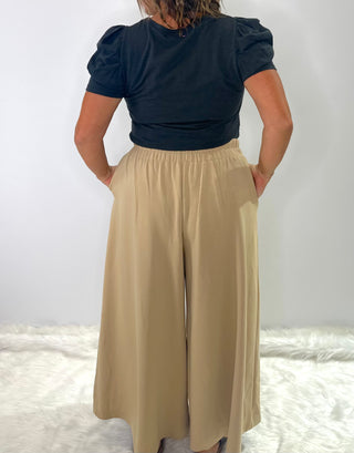 High waisted relaxed fit wide leg trousers with pleated front and elastic waistband