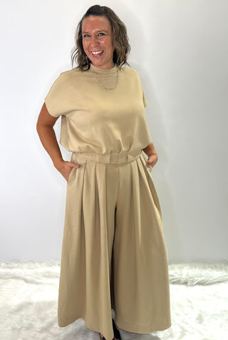 High waisted relaxed fit wide leg trousers with pleated front and elastic waistband