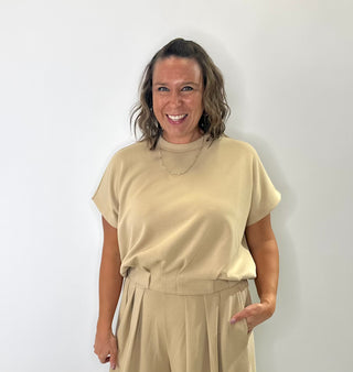 Relaxed fit crew neck t-shirt with oversized short sleeves and banded hem, styled for casual everyday wear