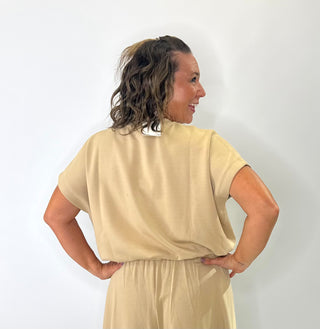 Relaxed fit crew neck t-shirt with oversized short sleeves and banded hem, styled for casual everyday wear