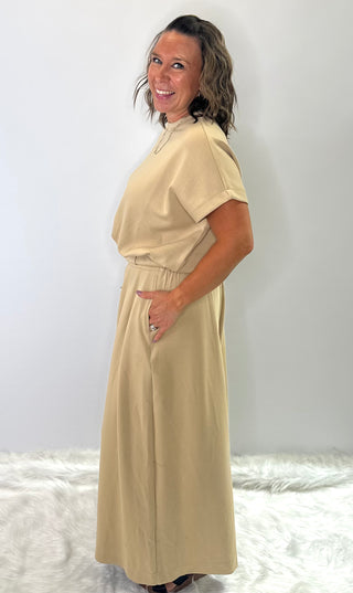 Relaxed fit crew neck t-shirt with oversized short sleeves and banded hem, styled for casual everyday wear