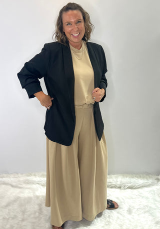 High waisted relaxed fit wide leg trousers with pleated front and elastic waistband