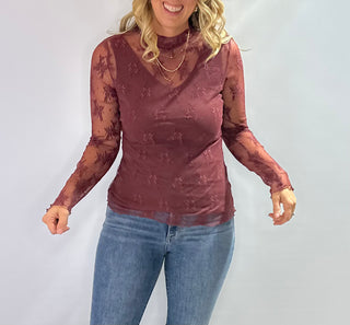 Burgundy embroidered mesh mock neck top with sheer fabric and elegant detailing