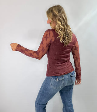 Burgundy embroidered mesh mock neck top with sheer fabric and elegant detailing