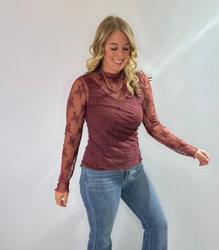 Burgundy embroidered mesh mock neck top with sheer fabric and elegant detailing