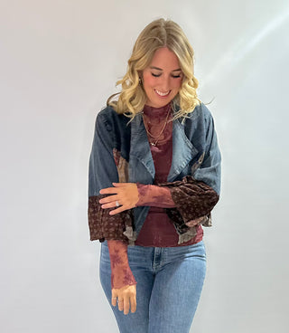 Burgundy embroidered mesh mock neck top with sheer fabric and elegant detailing