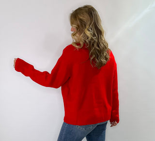 Red long sleeve knit turtleneck sweater with cute reindeer antlers, eyes and nose on the front 
