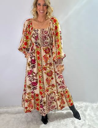 Cream and burgundy boho floral maxi dress with gathered sleeves and ruffle trim in a flowy silhouette