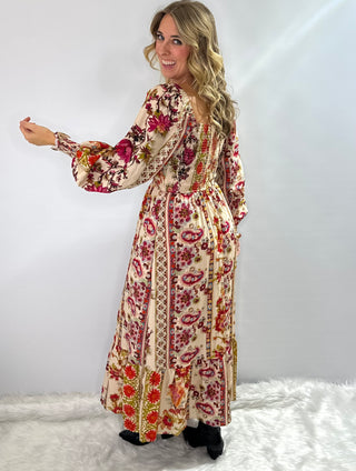 Cream and burgundy boho floral maxi dress with gathered sleeves and ruffle trim in a flowy silhouette