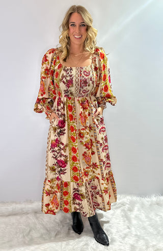 Cream and burgundy boho floral maxi dress with gathered sleeves and ruffle trim in a flowy silhouette