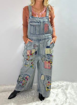 Blue Velvet Wildflower Roads Overalls in vintage-washed denim with boho embroidery, patchwork details, and oversized relaxed fit