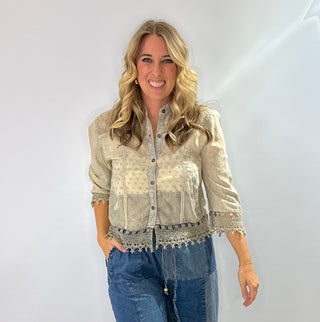 Jacquard crepe button front shacket top with shell buttons in a cream color with relaxed boho fit, pockets and lace hem details 