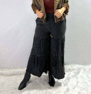 Black tiered wide-leg elastic waist bohemian pants with a matching modern western tunic.