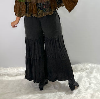 Black tiered wide-leg elastic waist bohemian pants with a matching modern western tunic.