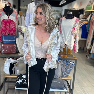 POL button front hooded jacket with white knit and floral boho pattern. 