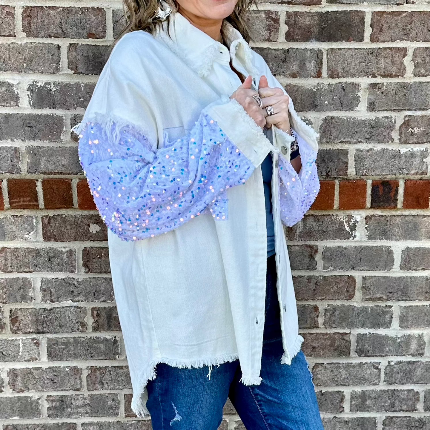 White denim jacket oversize with sparkle rhinestone sleeves and distressed hem 