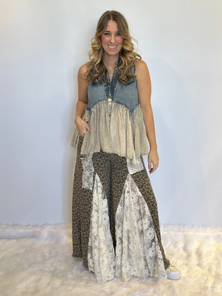 Taupe leopard print wide leg pants with lace and ruffle detailing, elastic waistband, full length exaggerated silhouette and side pockets