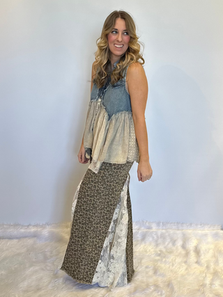 Taupe leopard print wide leg pants with lace and ruffle detailing, elastic waistband, full length exaggerated silhouette and side pockets