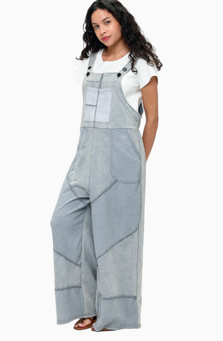 Grey French terry waffle knit patchwork jumpsuit with relaxed overall silhouette and adjustable straps 