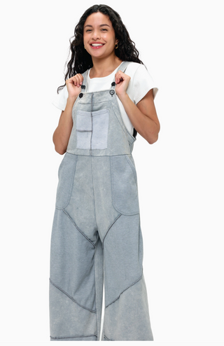 Grey French terry waffle knit patchwork jumpsuit with relaxed overall silhouette and adjustable straps 