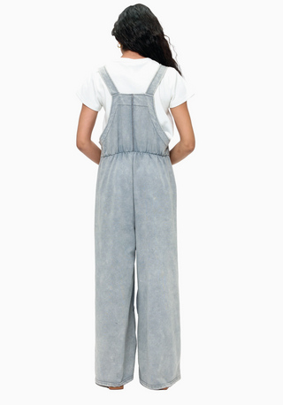 Grey French terry waffle knit patchwork jumpsuit with relaxed overall silhouette and adjustable straps 