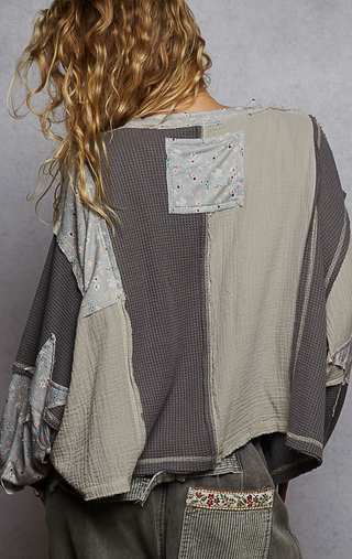 Gray French Terry Knit Oversized top with round neck balloon sleeves, ribbed cuffs and oversized peace sign floral patch with a button detail by Pol