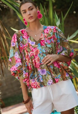Floral Printed Blouse in bright pink, green, and purple with wide bubble sleeves and plunge neckline with tie detail