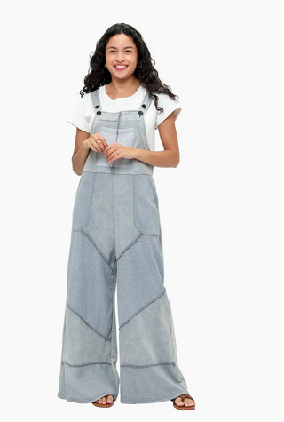 Grey French terry waffle knit patchwork jumpsuit with relaxed overall silhouette and adjustable straps 