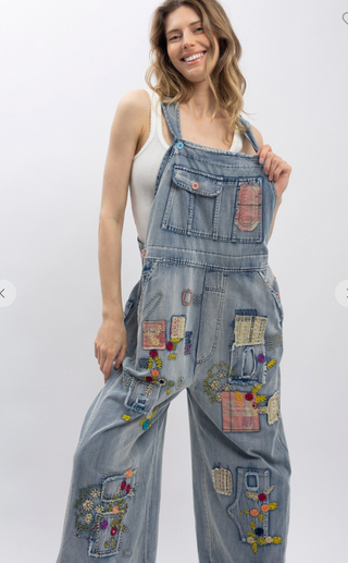 Blue Velvet Wildflower Roads Overalls in vintage-washed denim with boho embroidery, patchwork details, and oversized relaxed fit