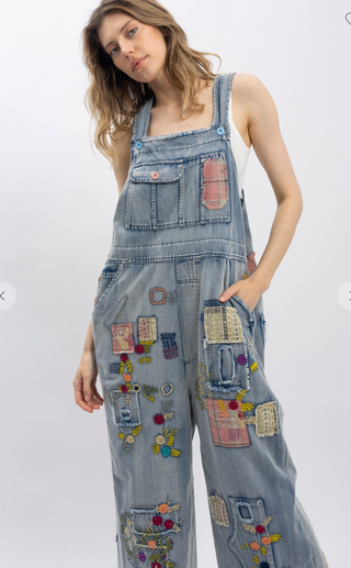Blue Velvet Wildflower Roads Overalls in vintage-washed denim with boho embroidery, patchwork details, and oversized relaxed fit