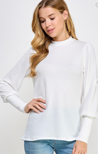 White ribbed mock neck sweater with uff sleeves and long cuffs, relaxed fit