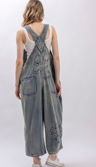 Flower Patchwork And Embroidered Denim Overalls with full length silhouette, adjustable button shoulder straps, side button closures, and functional bib pockets