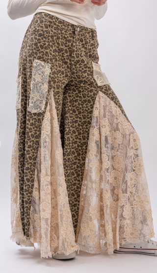 Taupe leopard print wide leg pants with lace and ruffle detailing, elastic waistband, full length exaggerated silhouette and side pockets