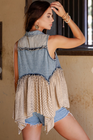 Distressed boho western denim sleeveless top with ruffle details, button front closure, and flowy panel construction 