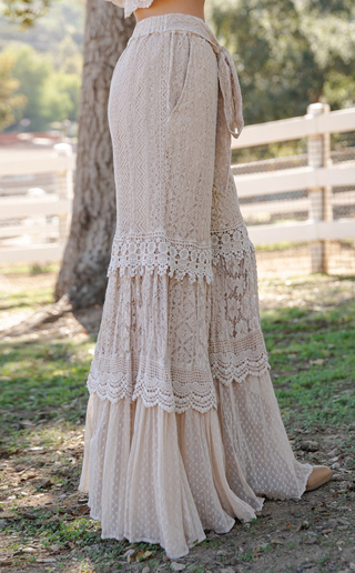 Wide leg tiered flow pants featuring lace and cotton voile mixed media with elastic waistband and full length boho silhouette