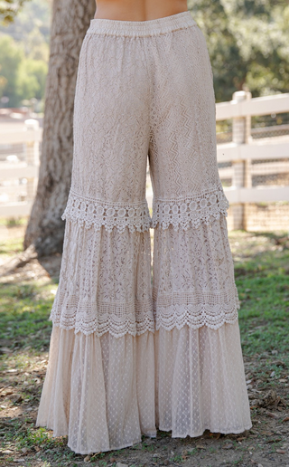 Wide leg tiered flow pants featuring lace and cotton voile mixed media with elastic waistband and full length boho silhouette