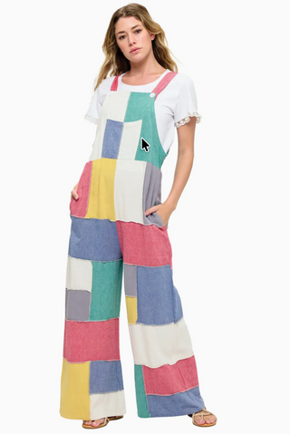 Vibrant patchwork cotton overalls featuring a mix of colorful prints and textures, relaxed fit with adjustable straps, front bib pocket, and wide leg silhouette for a playful boho look